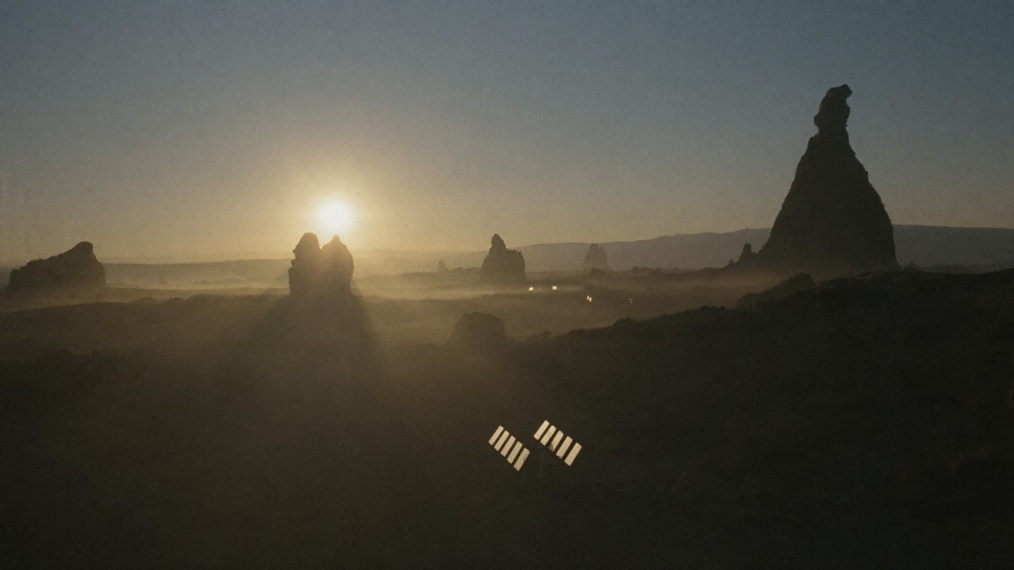 Sun rising over the Jos Plateau with a small solar array in the foreground