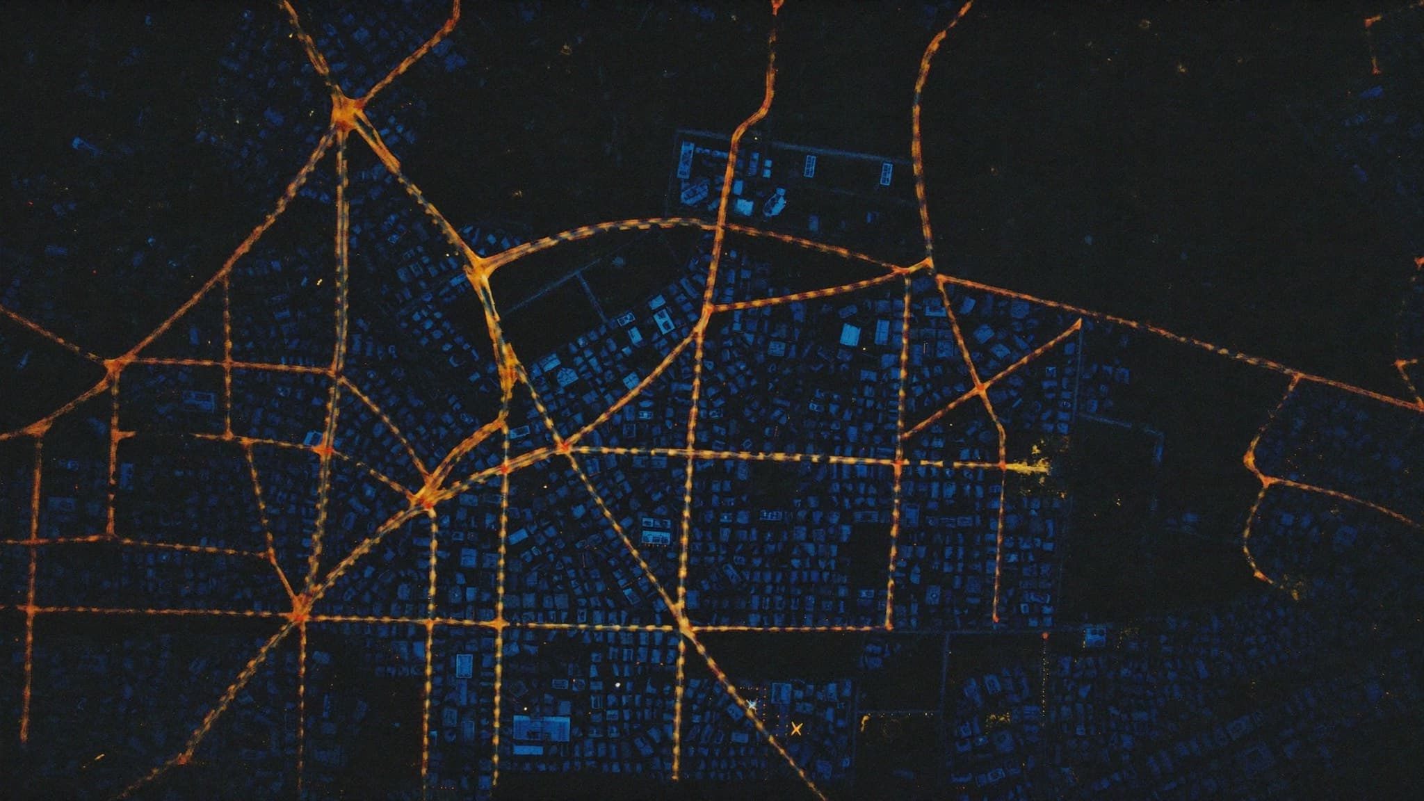 Aerial view of Abuja at night with its glowing road grid