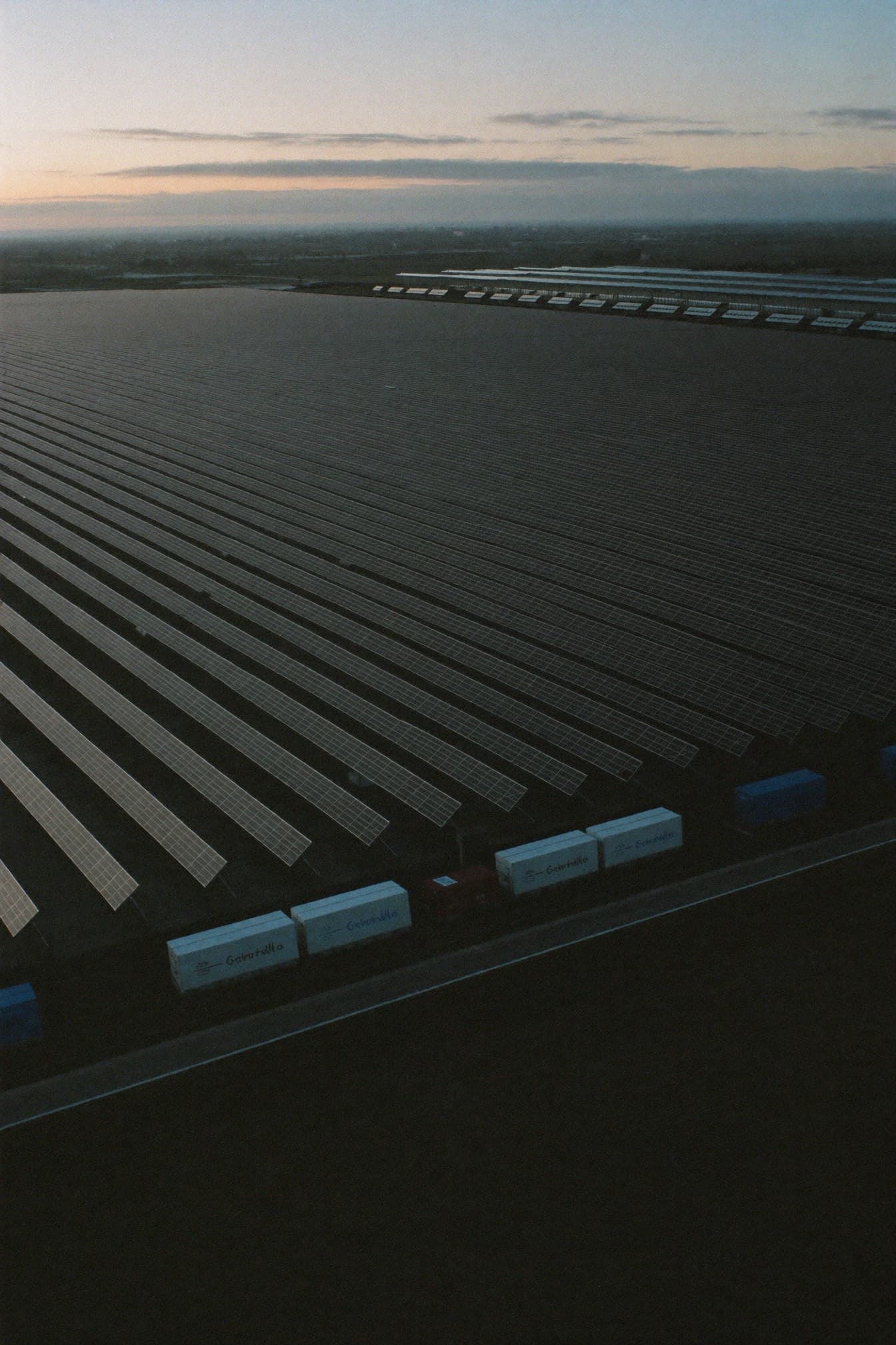 Aerial view of a solar and battery storage site at dusk
