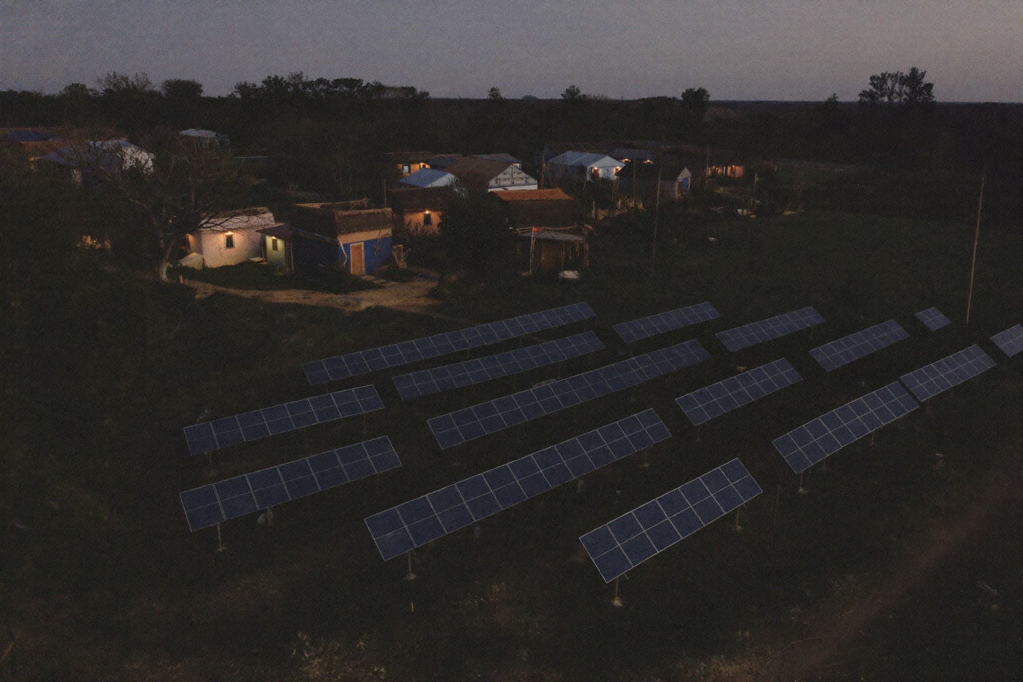 Rural Nigerian village powered by a solar mini-grid at dusk